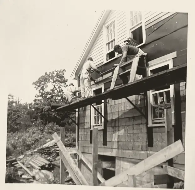 Archival photo of workers repairing the Wayside Church building